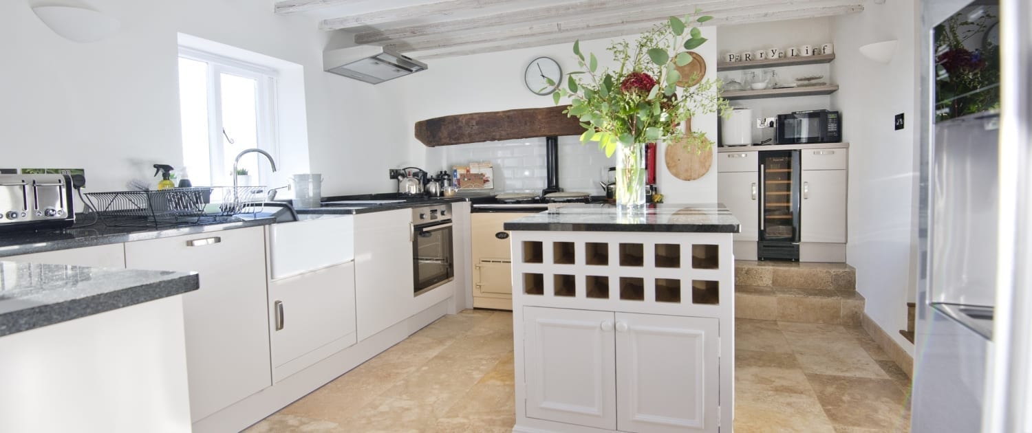 kitchen showing two steps to wine fridge